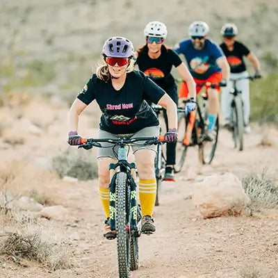 Wyldflower Nomad: Mountain Biking T-Shirts, Tank Tops, and Bigfoot Gear for Adventure Seekers, women in bike therapy shirts cycling.